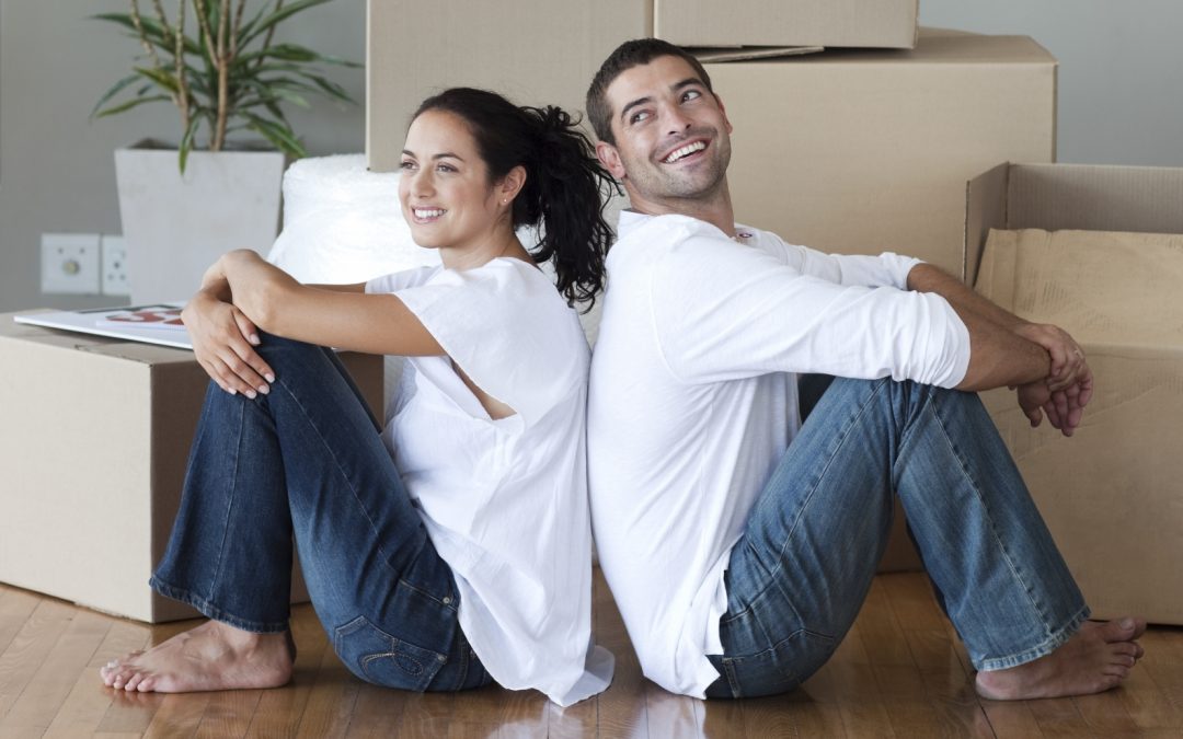 Happy couple on their home moving day